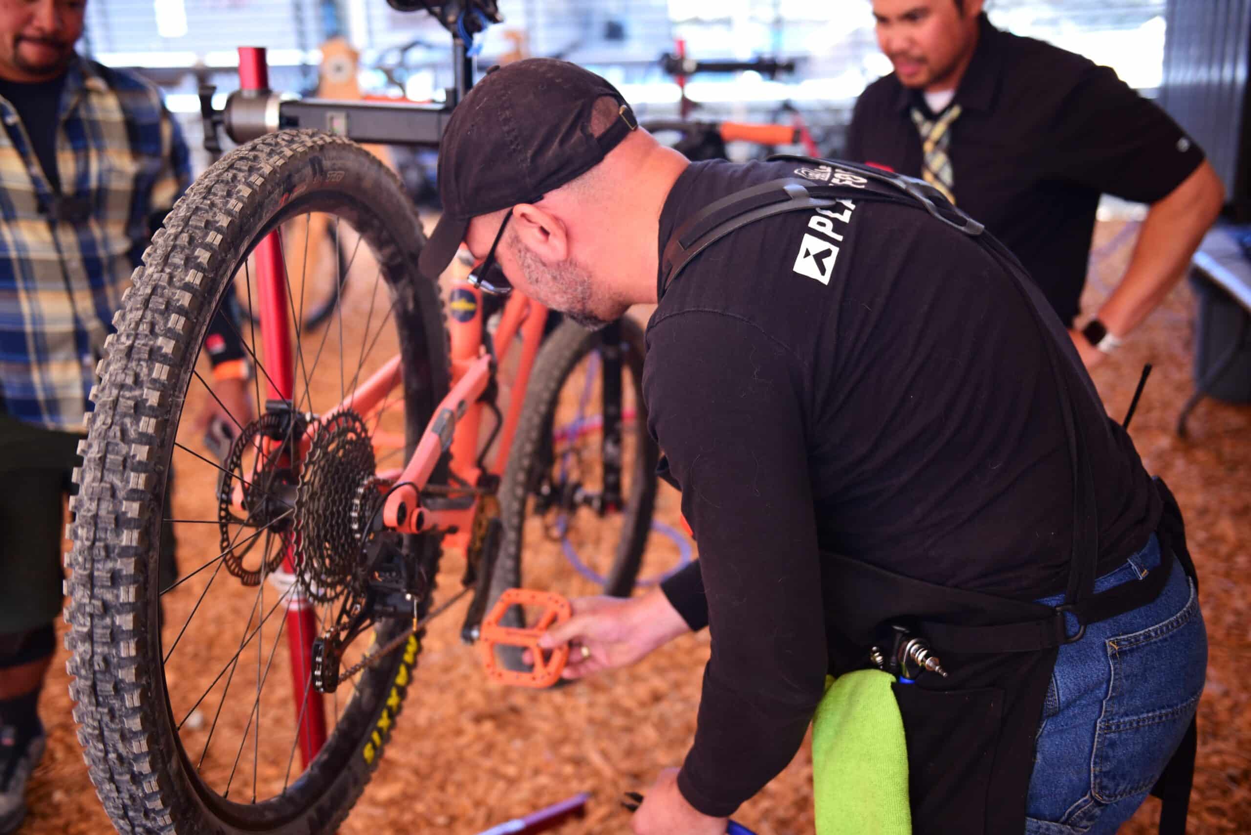 Rental team working on a bike