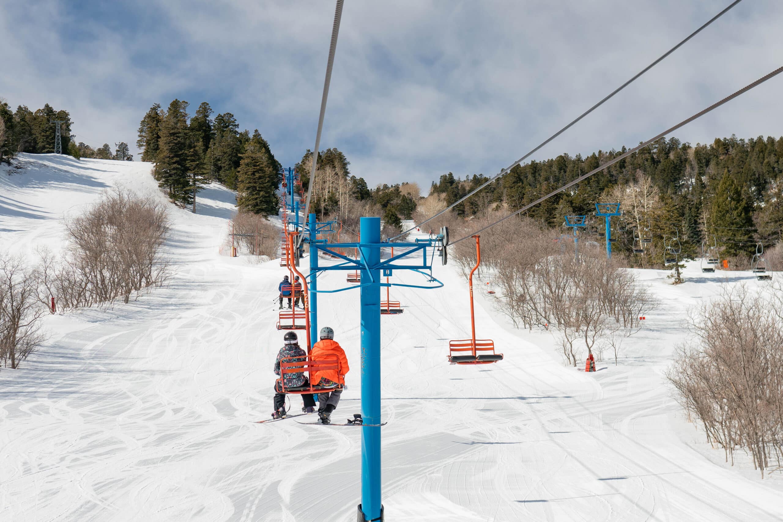 Riders on chairlift at Sandia Peak Ski Area